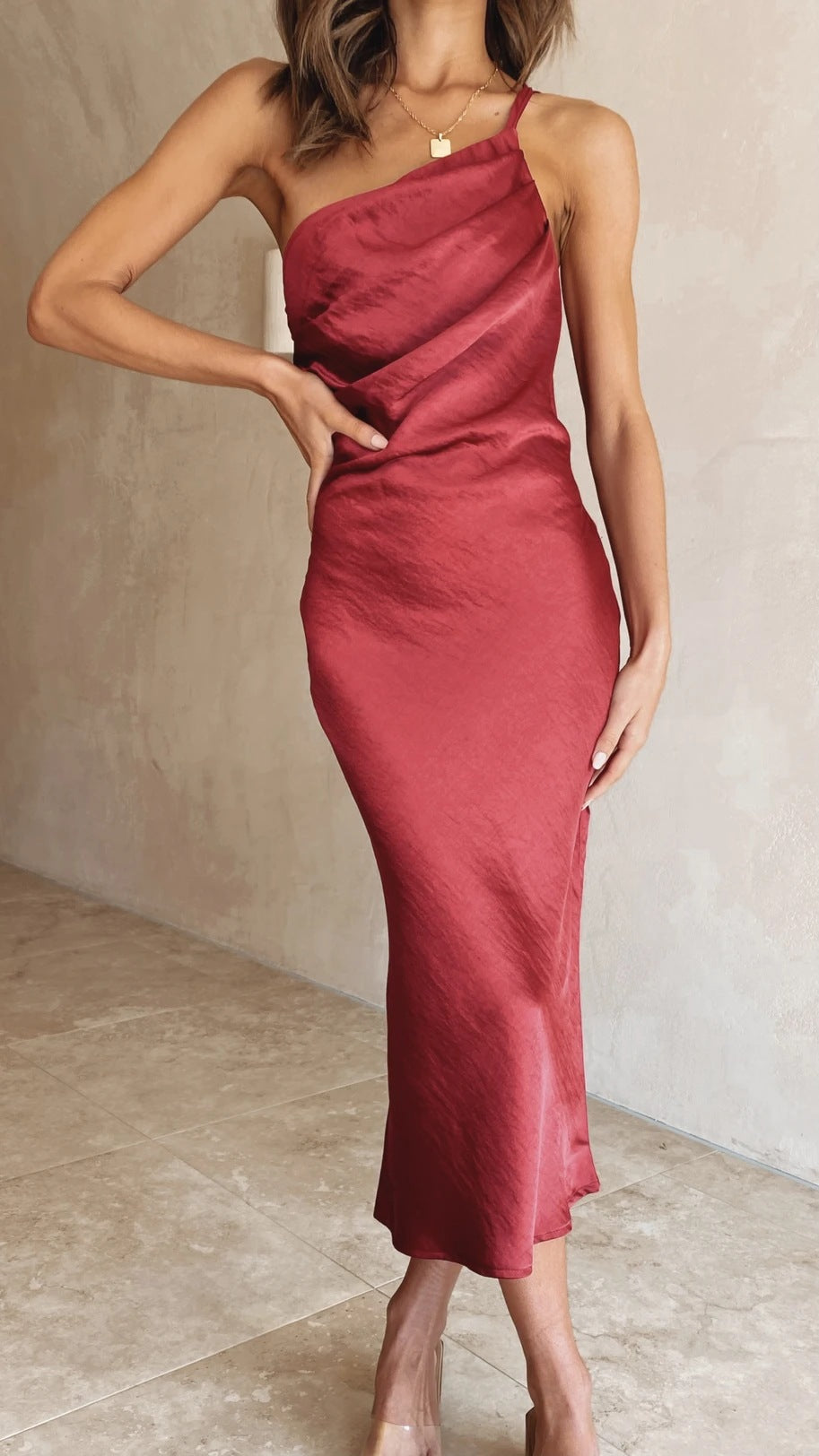 Women's satin midi dress with asymmetrical cut and elegant flair Skovae