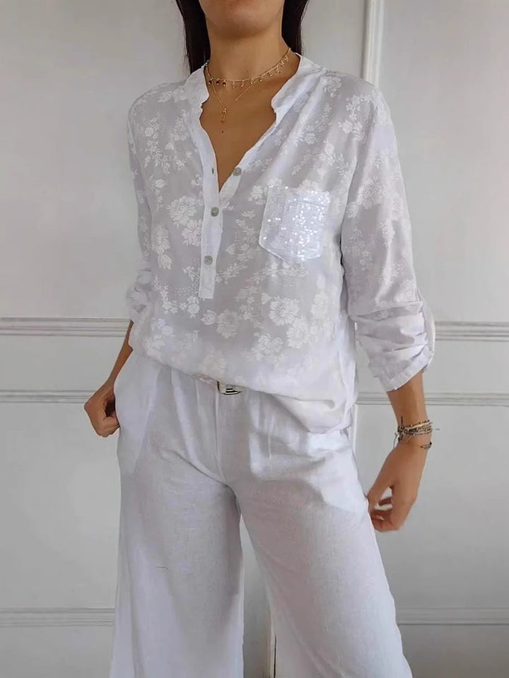 Dame blouse top med blomstermønster og glitrende pailletter Stilla