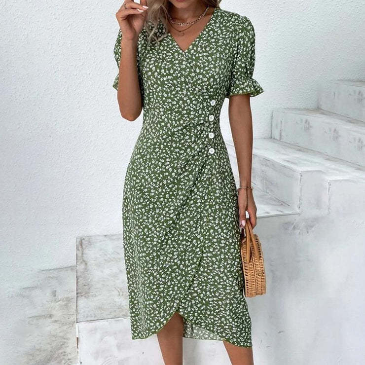Dame wrapkjole med floral design og elegante knapdetaljer Stilla