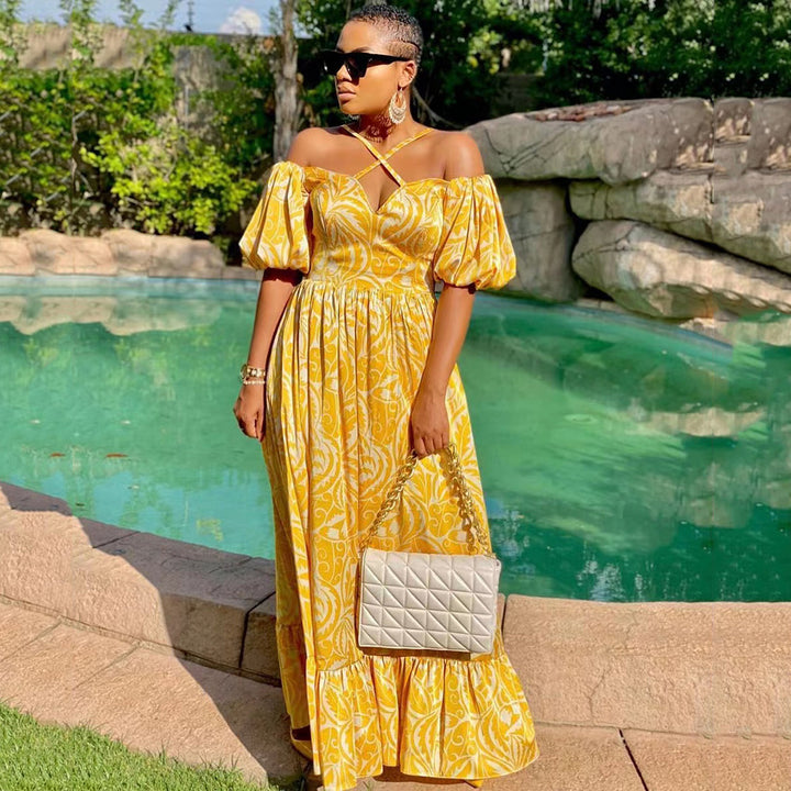Dame maxikjole med off-shoulder snit og blomsterdetaljer Stilla