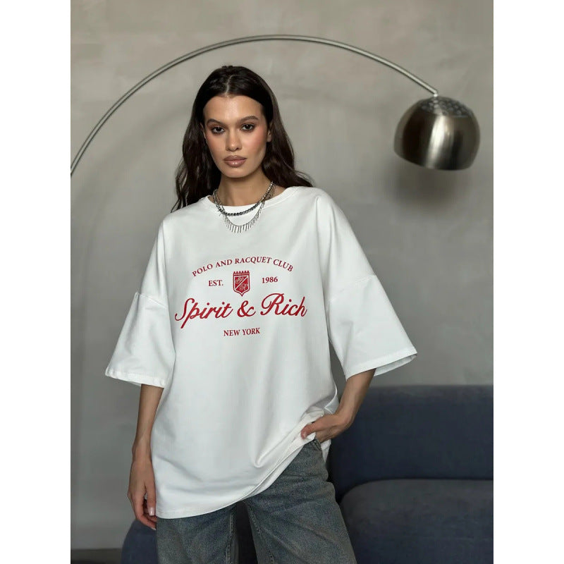 Dame Oversized T-shirt med afslappet polo-design og inspirerende statement Stilla