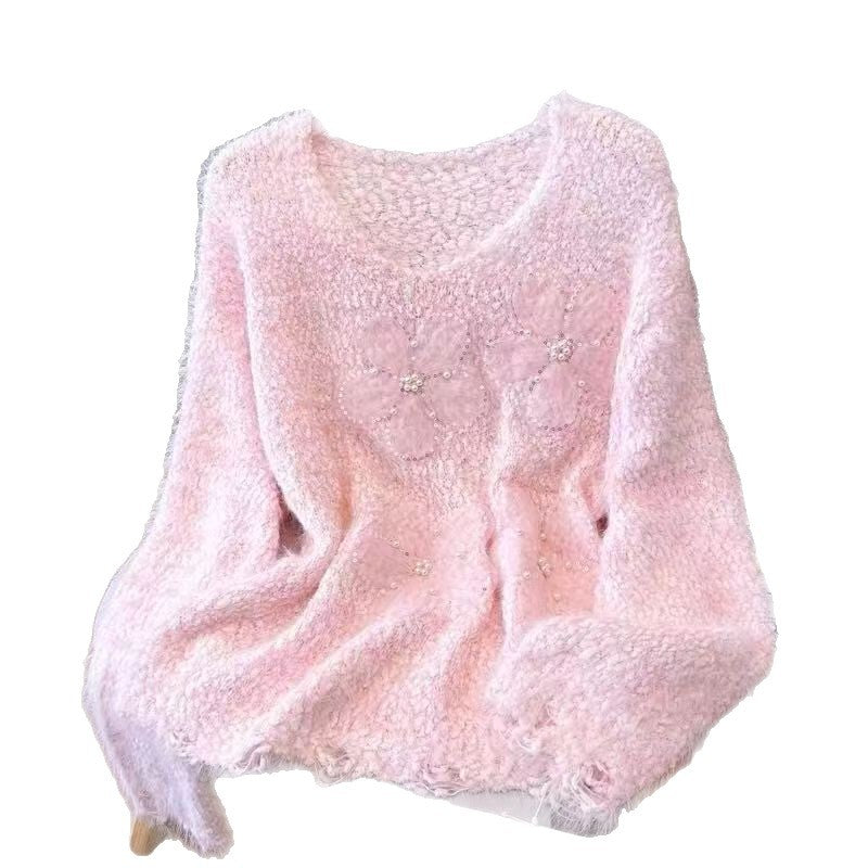Kvindernes hyggelige sweater med blomsterapplikationer Stilla