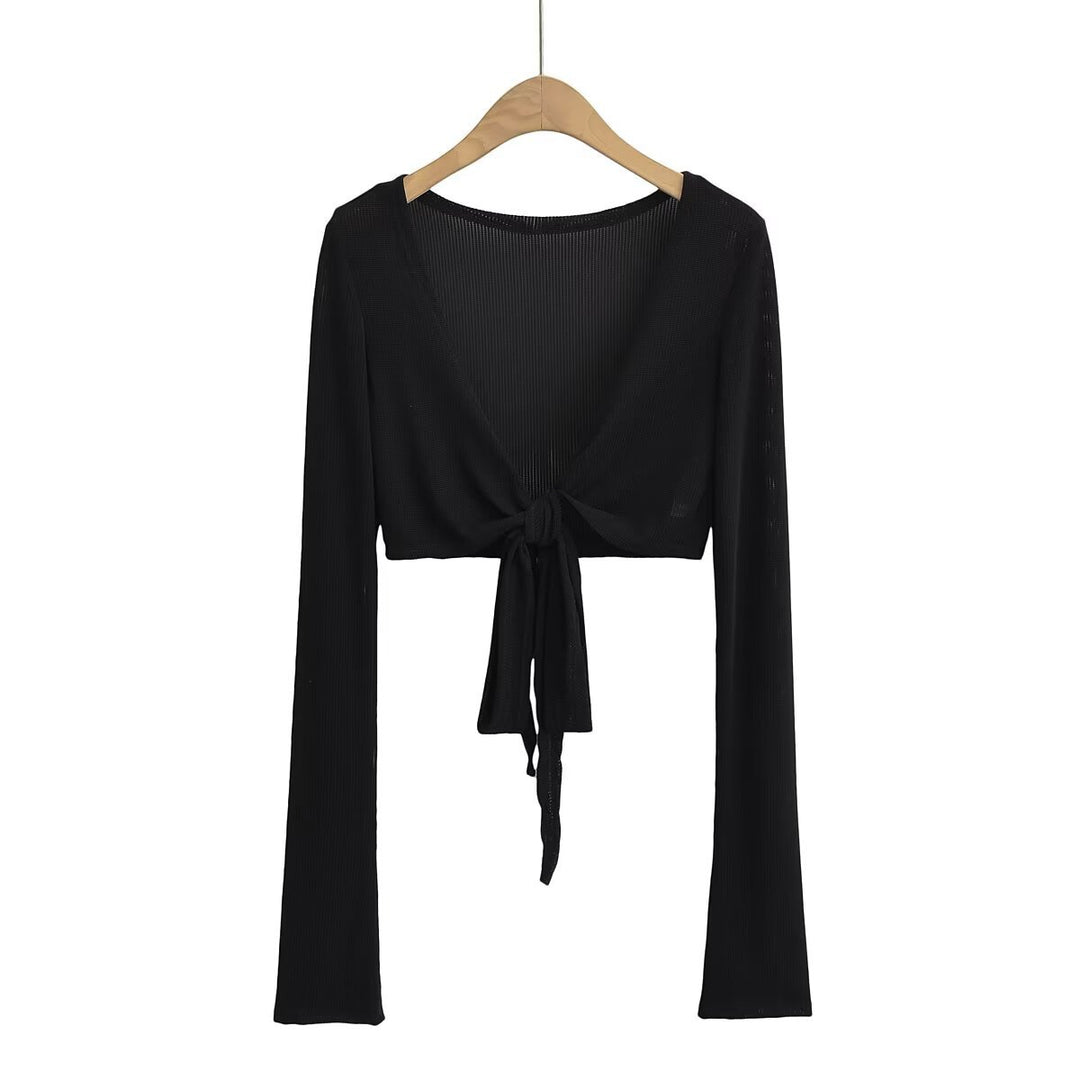 Dame cropped langærmet top med raffineret knude-design og elastisk stof Stilla