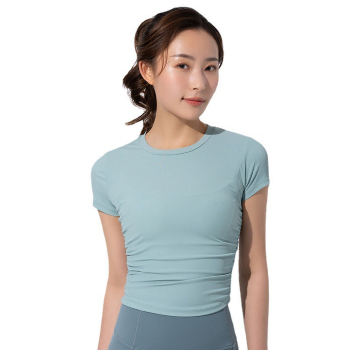 Dame sporty kortærmet crop-top med fashionable rynkeelementer og elastisk pasform Stilla