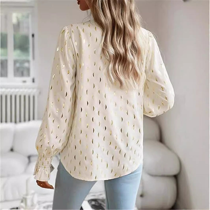 Damebluse med elegant guldmønster Stilla