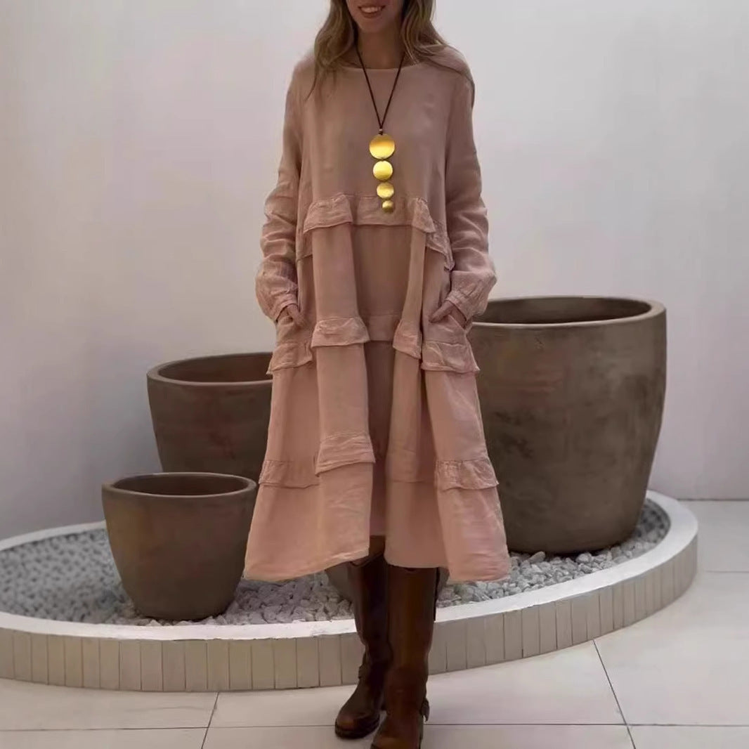 Dame linnedress med voluménøst lagdesign og sidelommer Stilla
