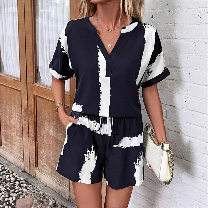 Damer kortærmet jumpsuit med moderne grafiktryk Stilla