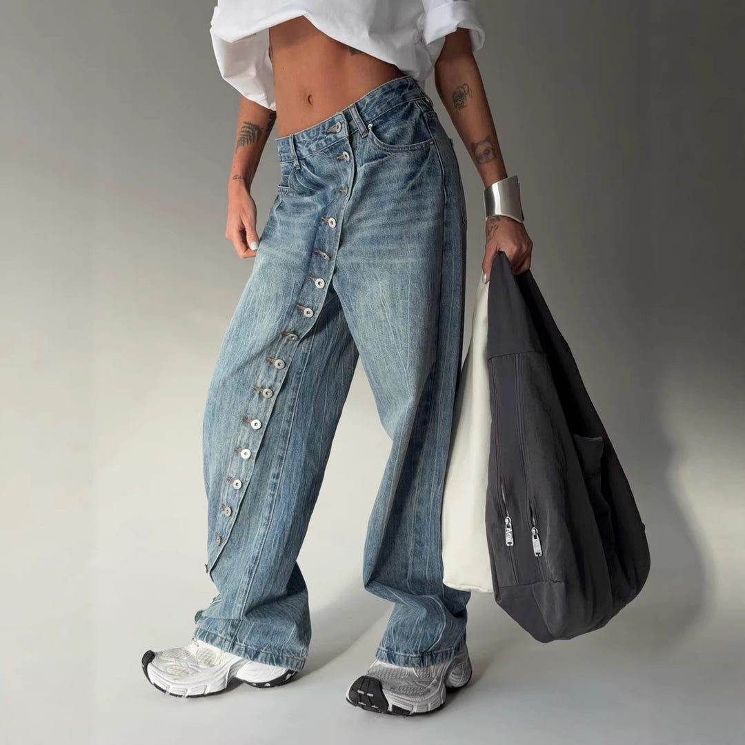 Kvinders bredskårne jeans med en continuér knapstolpe Stilla
