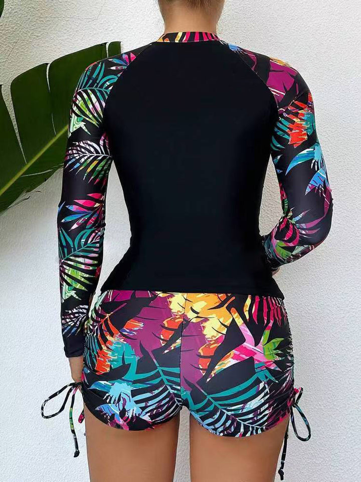 Dame Rashguard og shorts sæt med farverigt bladmønster Stilla