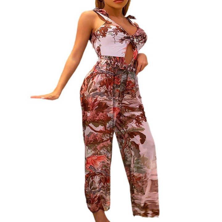 Dame jumpsuit med blomsterdesign og raffinerede bindebånd Stilla