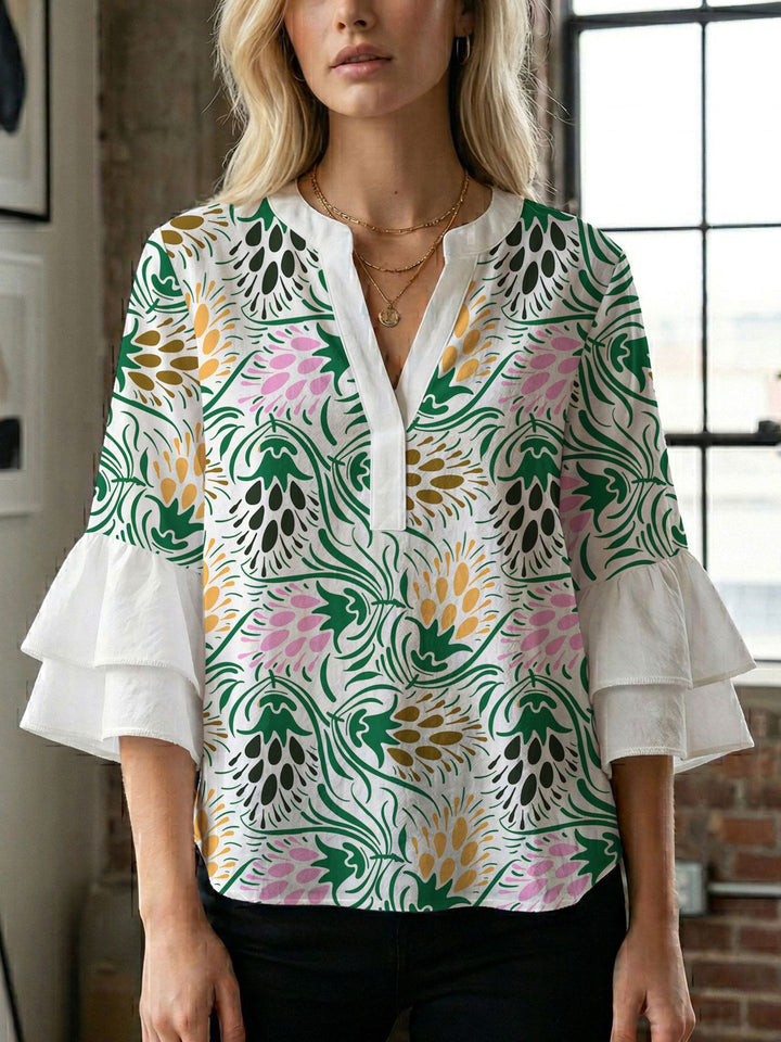 Dame bluse med voluminøse ærmer og kreativt trykdesign Skovae