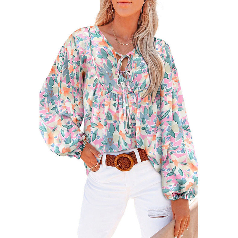 Damebluse med blomsterdesign og voluminøse ærmer Stilla