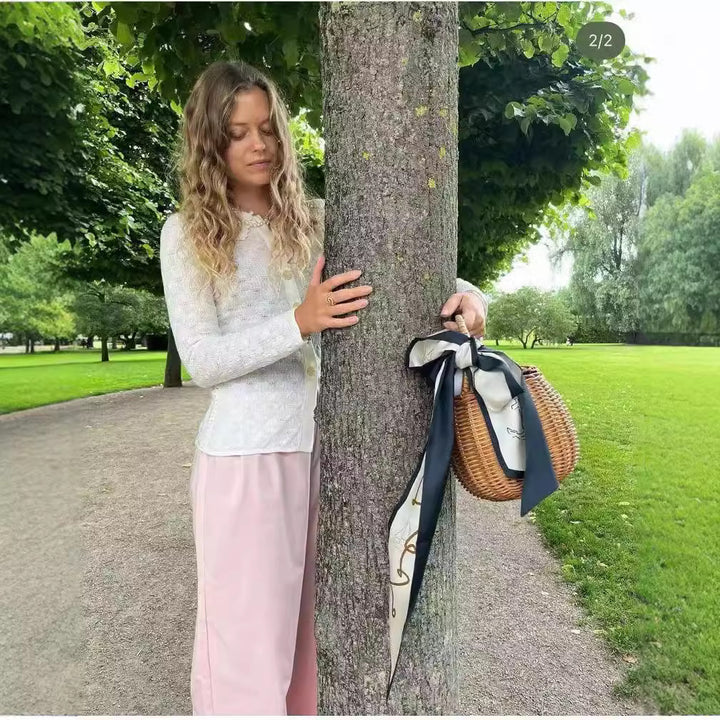 Damer strikjakke med elegant krave og fine knapdetaljer Stilla