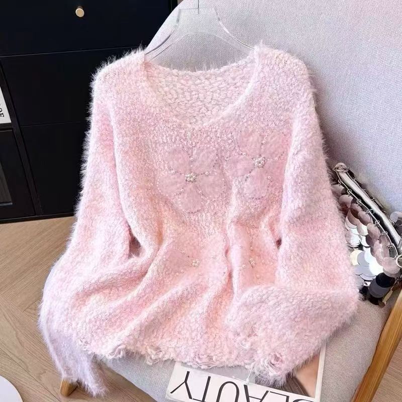 Kvindernes hyggelige sweater med blomsterapplikationer Stilla