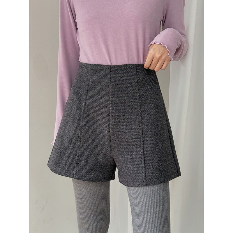 Dame shorts i det elegante houndstooth-mønster med høj talje og folder Stilla