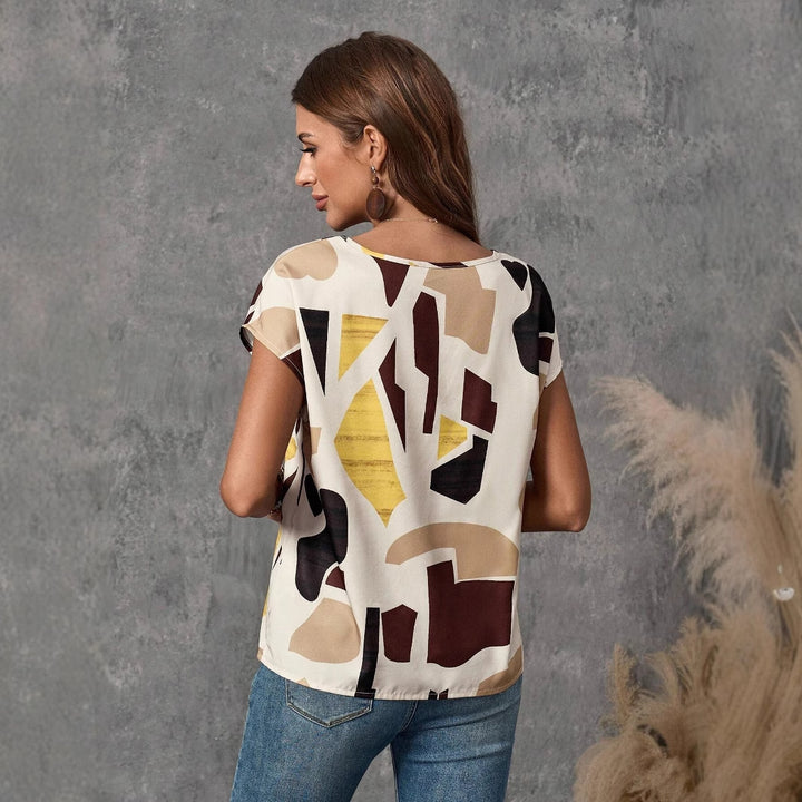 Dame afslappet top med moderne abstrakt design Stilla