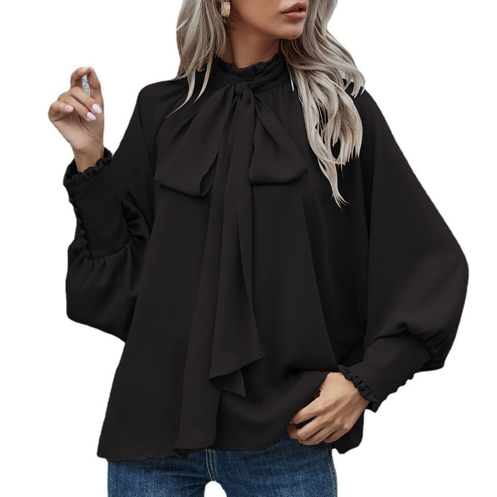 Damebluse med raffineret sløjfedetalje og elegant rund halsudskæring Stilla