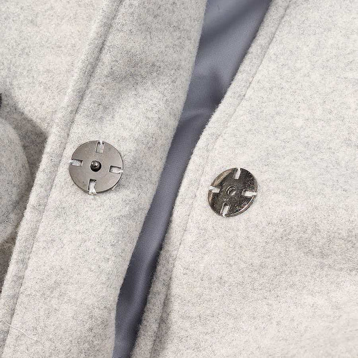 Kvinders stilfulde uldjakke med aftagelig hætte og teddyforing Stilla