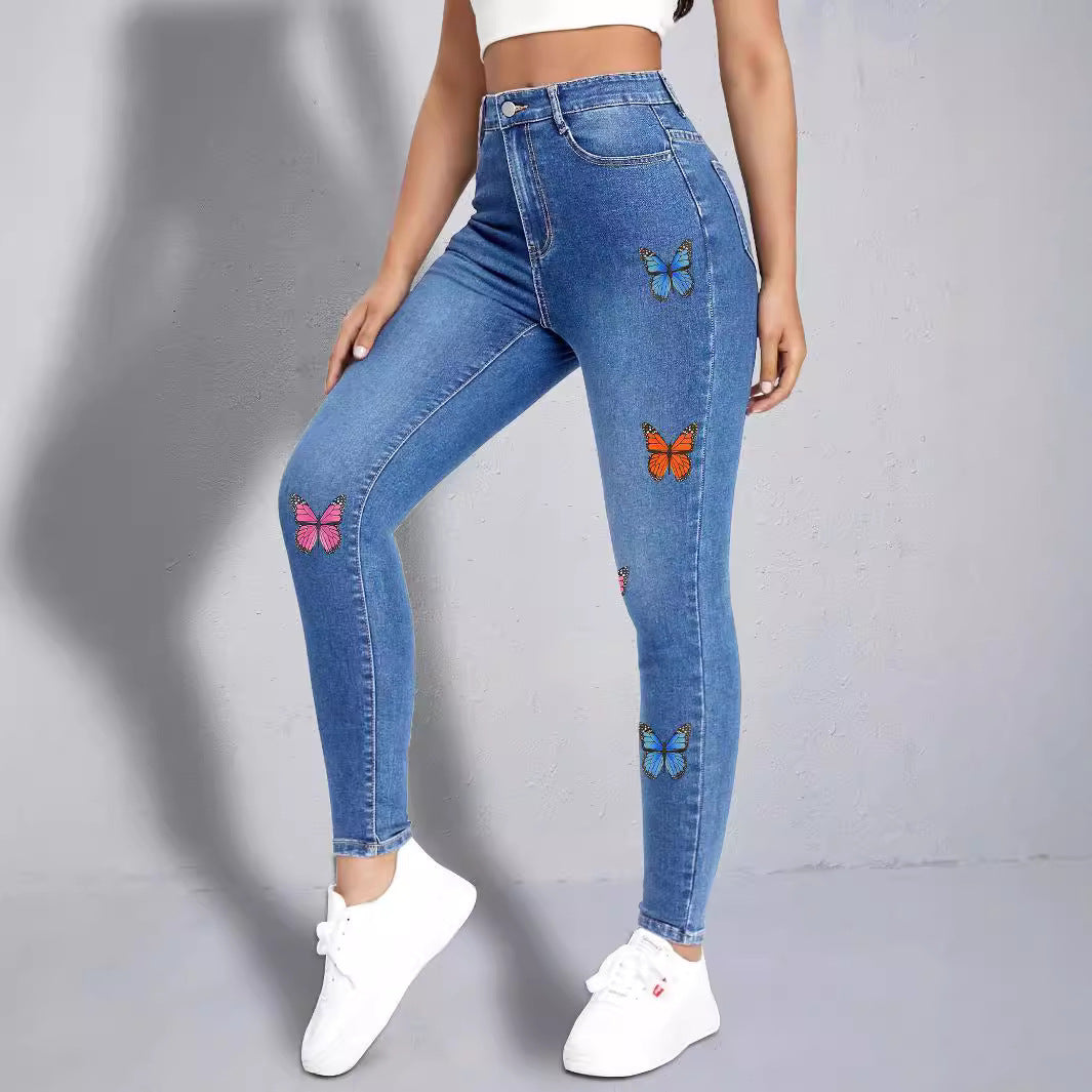 Dame Skinny Jeans med farverige sommerfugleapplikationer Stilla