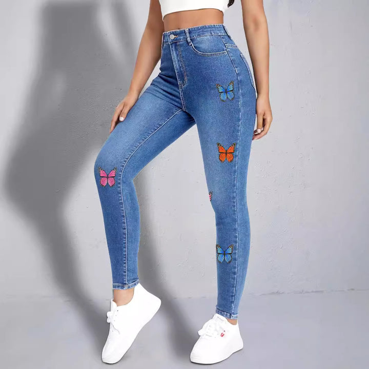 Dame Skinny Jeans med farverige sommerfugleapplikationer Stilla