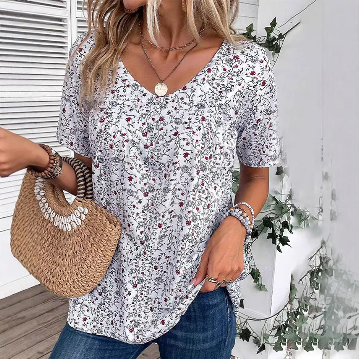 Dame nan afslappet kortærmet tunika-shirt med rund halsudskæring, delikat blomsterprint og dekorative brystfolder Skovae