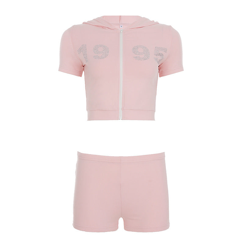 Dame sporty cropped hoodie-sæt med korte shorts og glansfulde accenter Skovae
