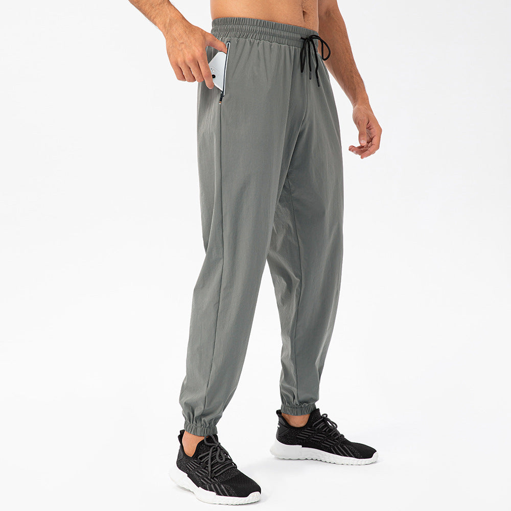 Herrer Sporty Joggingbukser med elastisk taljebånd og praktiske lynlåslommer Stilla