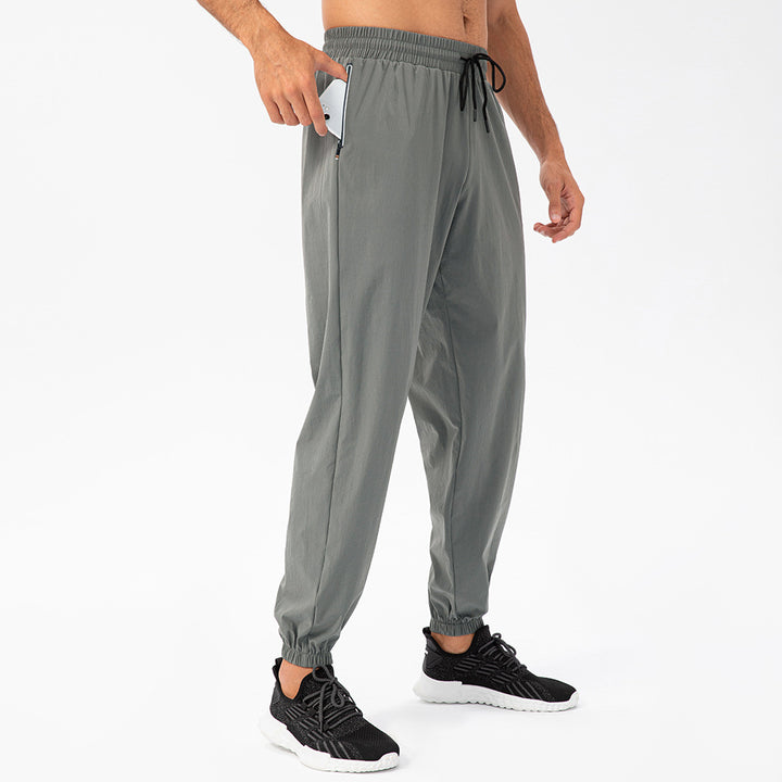Herrer Sporty Joggingbukser med elastisk taljebånd og praktiske lynlåslommer Stilla
