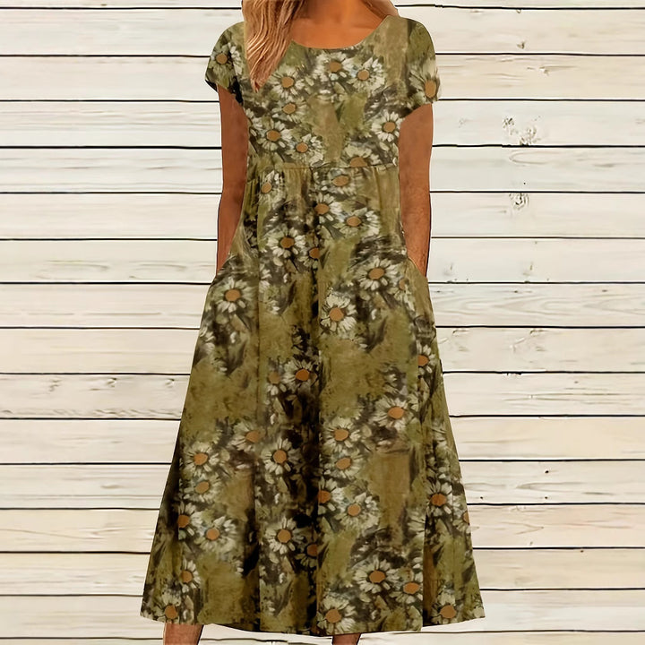 Dame Maxikjole med legende blomsterdesign og praktiske sidelommer Stilla