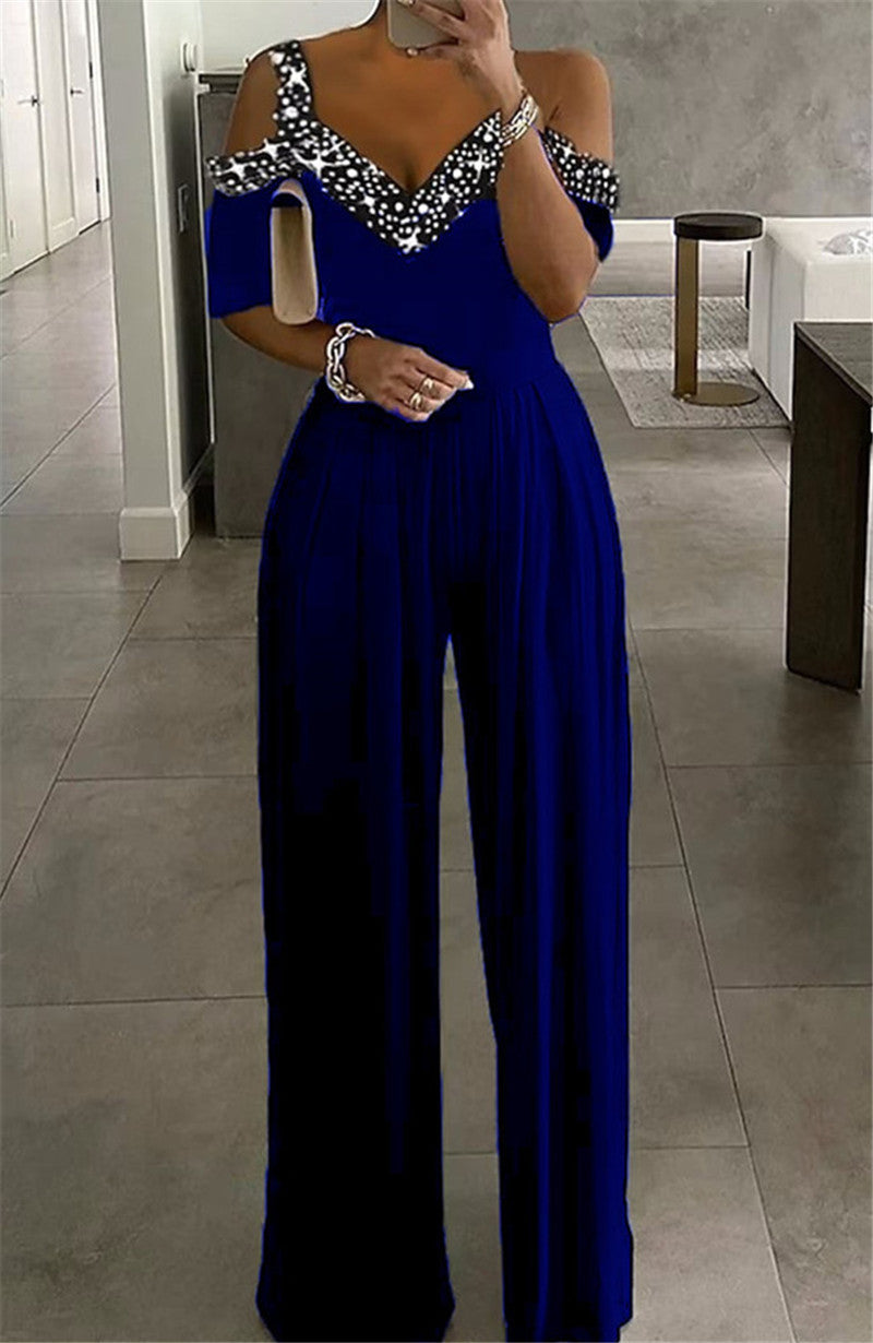 Dame Jumpsuit med elegant V-udskæring og modige cut-outs Stilla