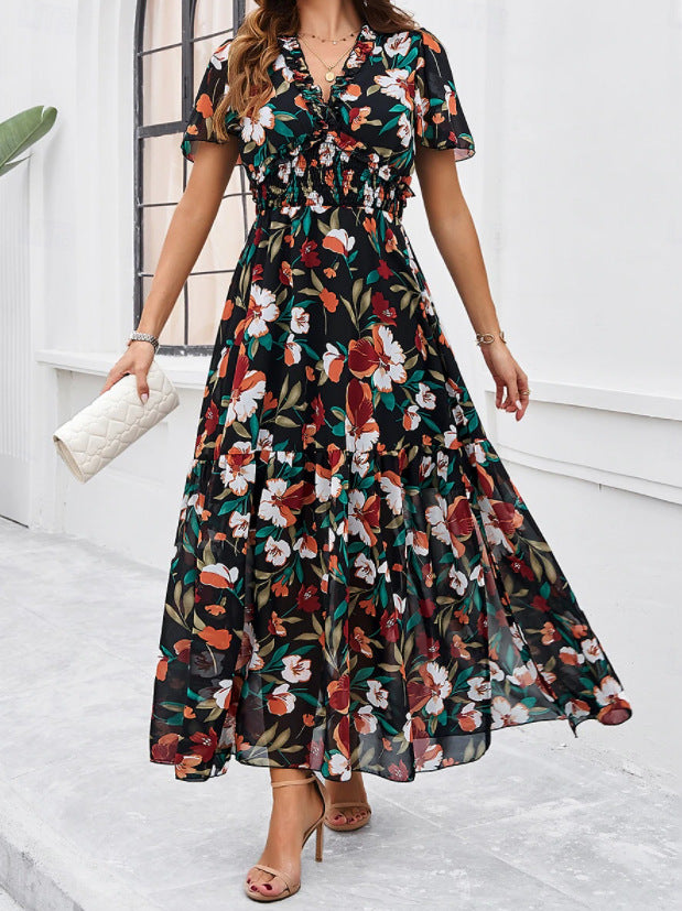 Dame maxikjole med blomsterprints og svungent snit Stilla