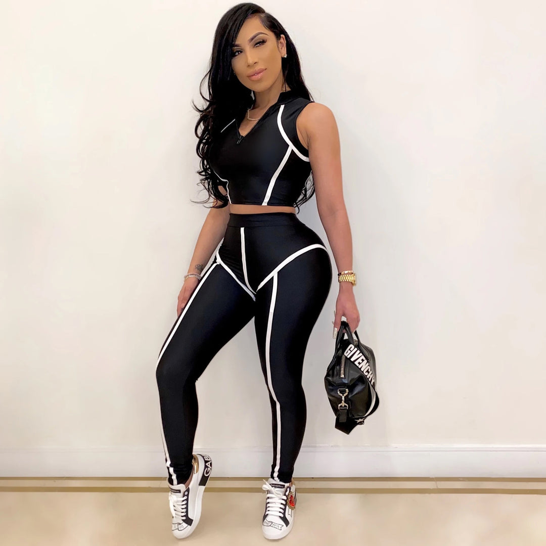 Dame sportsæt med cropped top og figursmigrende leggings Stilla