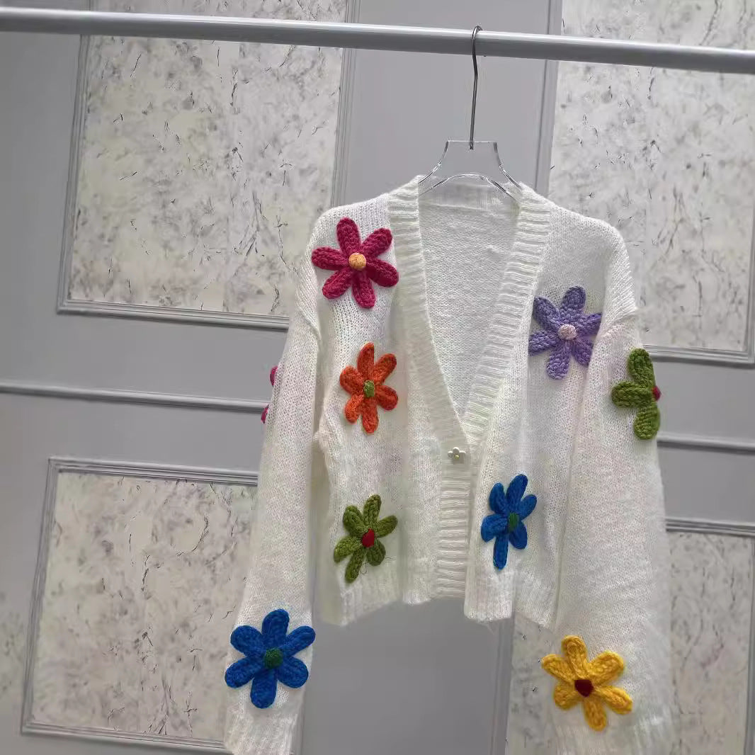 Dame strikjakke med farverigt blomsterdesign Stilla