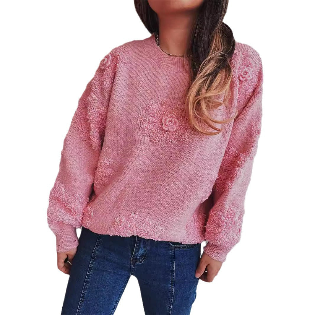 Kvindernes glade sweater med blomsterapplikationer og tekstureret strikdesign Stilla