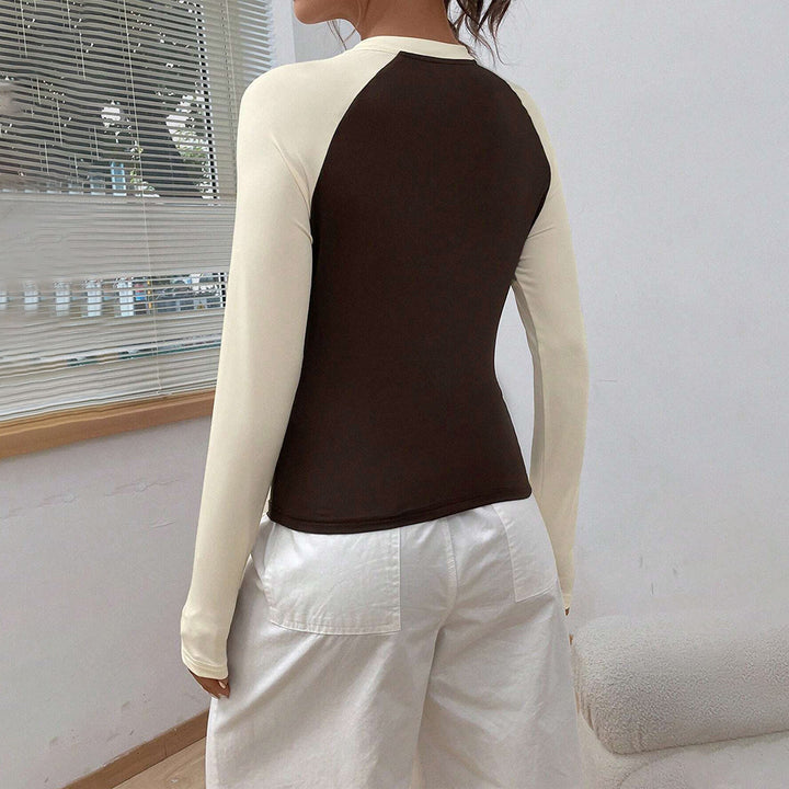 Kvindernes langærmede skjorte med moderne raglan-design og figursyet pasform Stilla