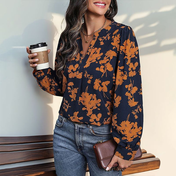 Damebluse med blomstertryk og elegante pufærmer Stilla