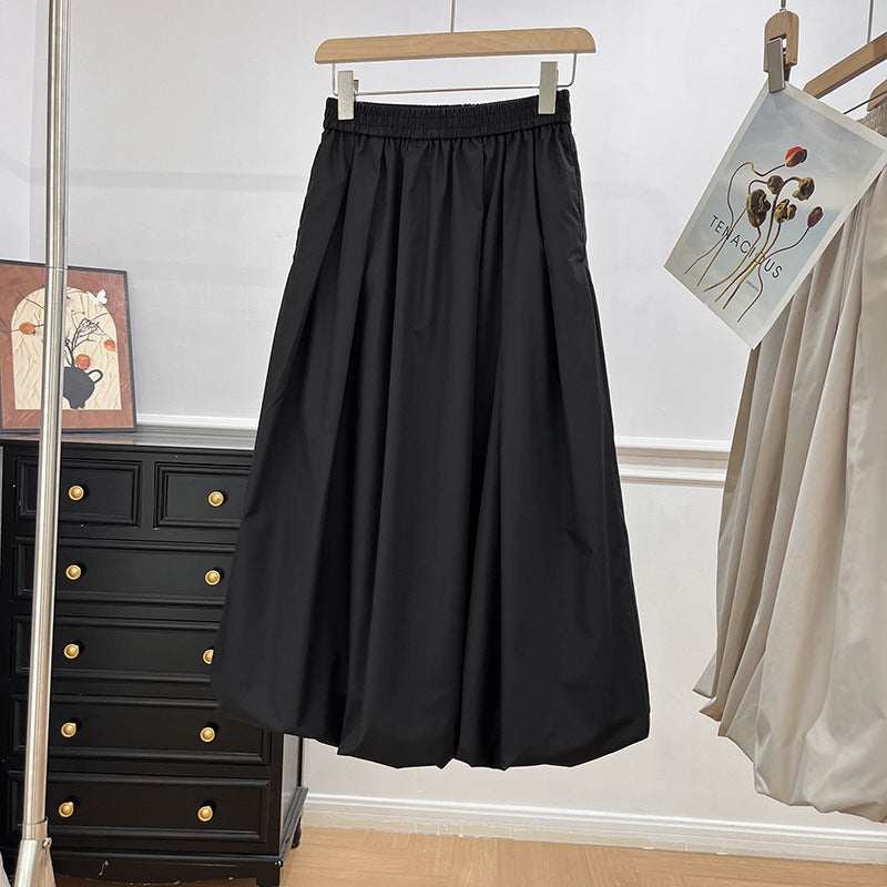 Kvinders elegante midi-nederdel med elastisk talje og voluminøs skæring Stilla