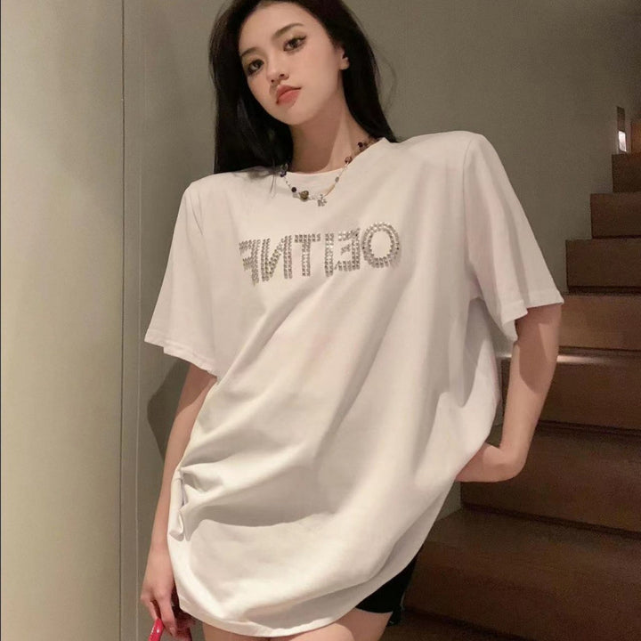 Dame T-shirt med glitrende skrift og afslappet oversized snit Stilla