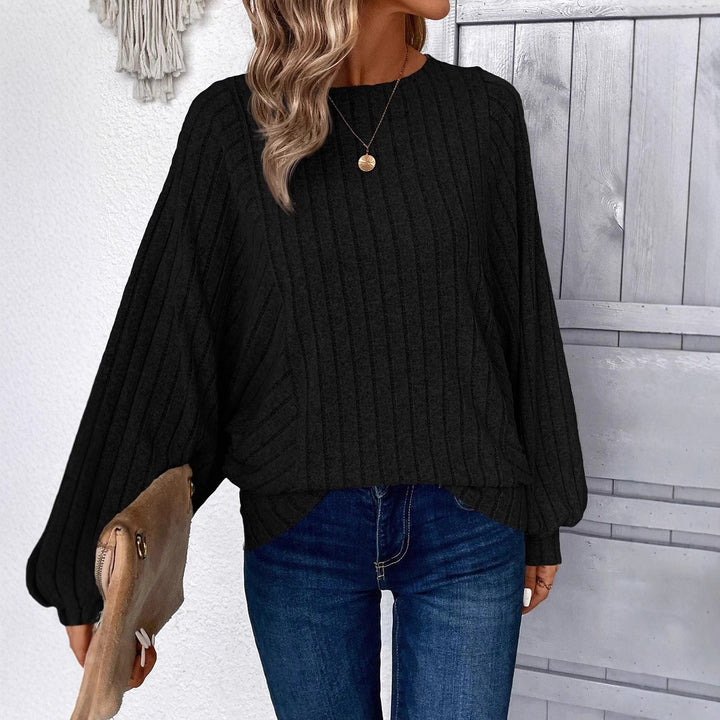 Dame sweater med elegante ballonærmer og ribbestruktur Stilla