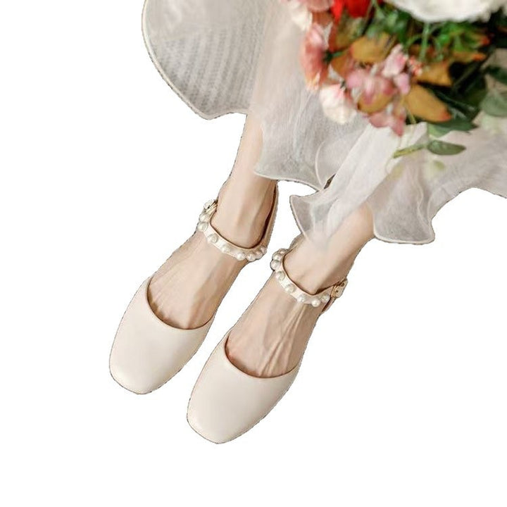 Dame Slingback-pumps med elegant perleapplikation og komfortabel blokhæl Stilla
