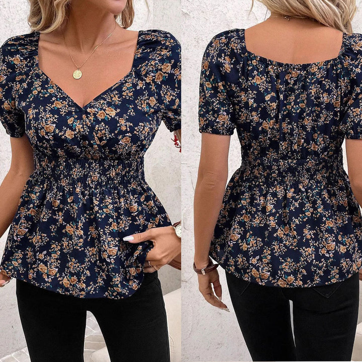 Damebluse med blomsterdesign og elastisk liv Stilla