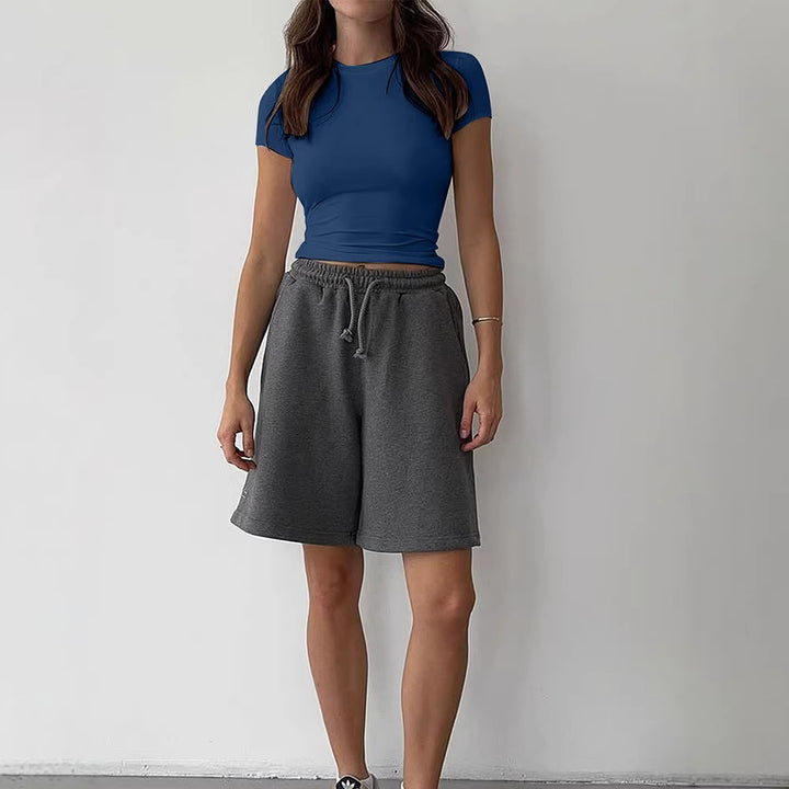 Dame afslappet cropped T-shirt i hudvenligt materiale med rund halsudskæring Skovae