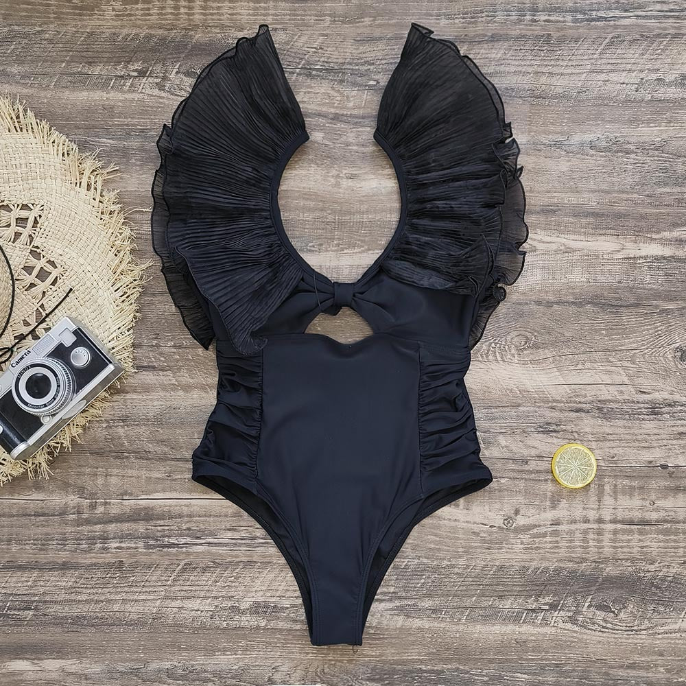 Dame one-piece badedragt med voluminøse flæsedetaljer og elegant V-udskæring Stilla