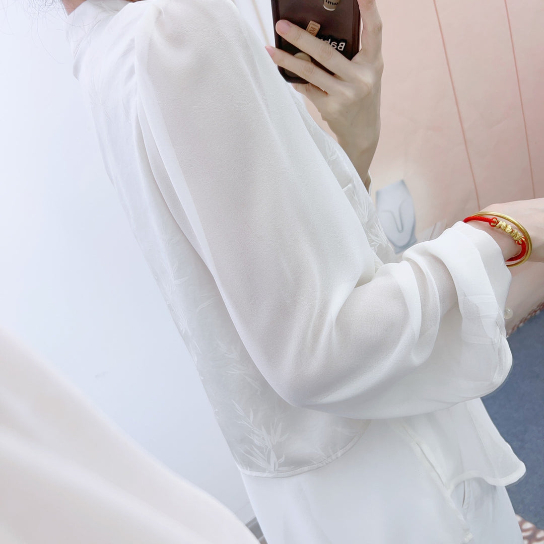 Damebluse med blomsterdesign og elegant krave Stilla