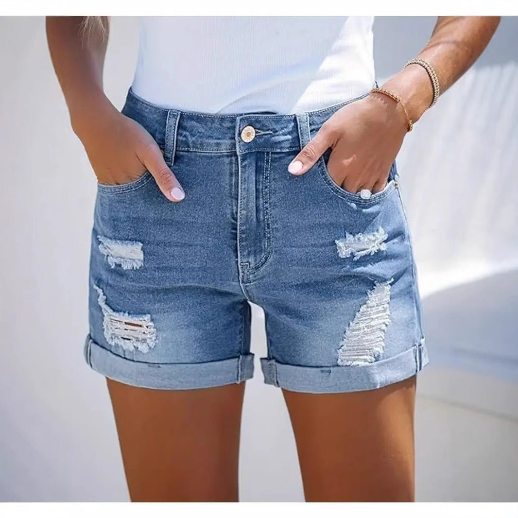 Dame korte Destroyed Denim-shorts i afslappet look med opsmøgede masker og stilfulde revnedetaljer Skovae