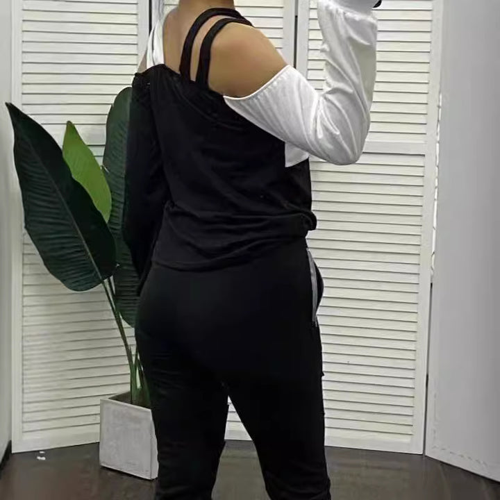 Dame Mode top med cut-out design og asymmetrisk ærmer Skovae