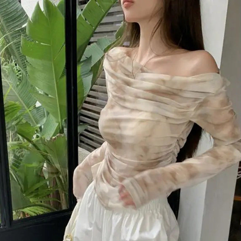Kvindernes elegante langærmede top med samlet design Stilla