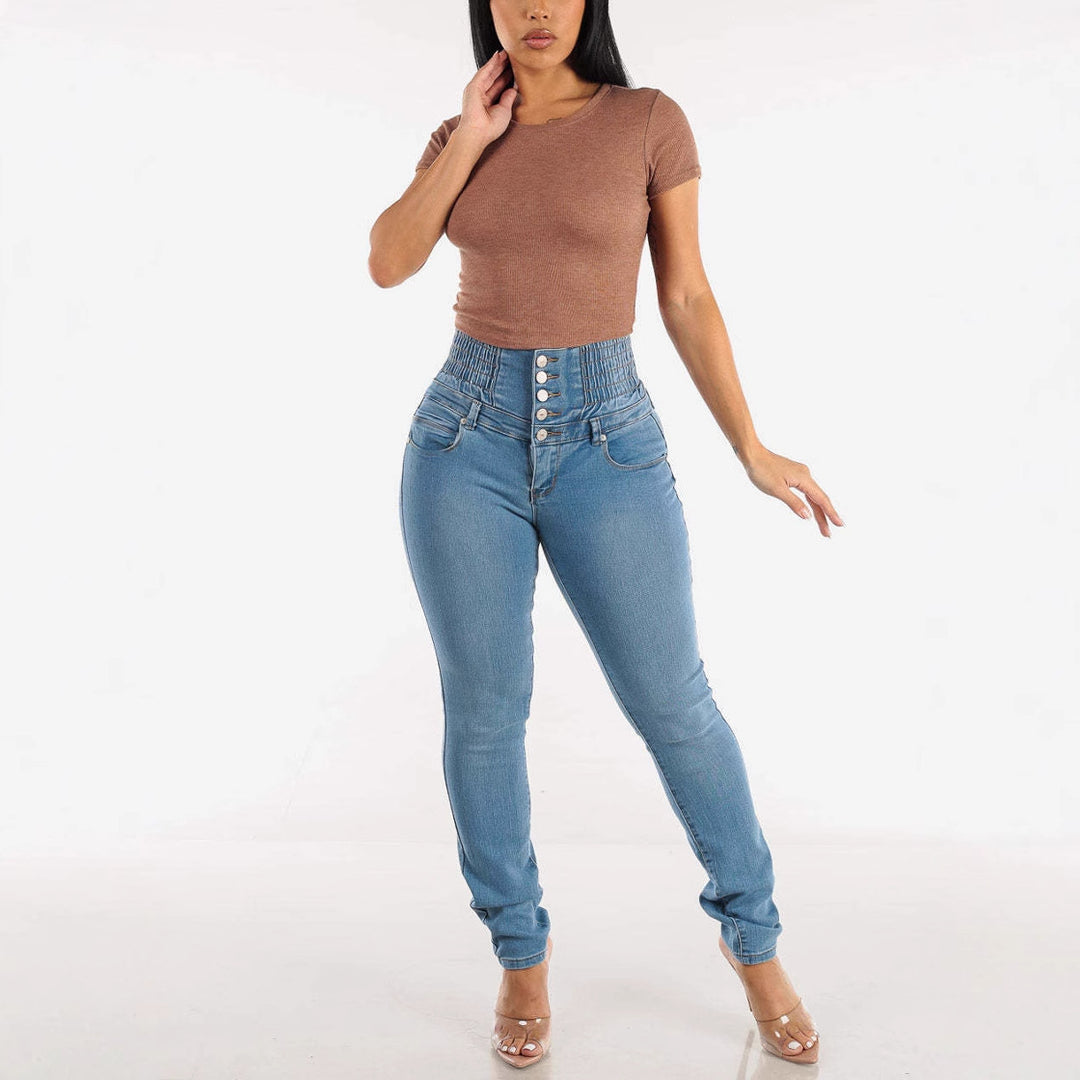 Kvindelige høje skinny jeans med dekorative knapper og elastisk talje