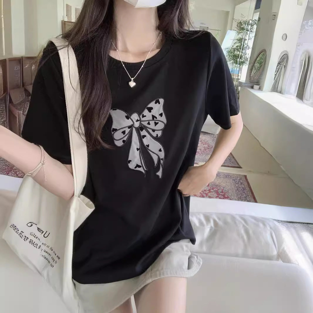 Femme Legende Sløjfe Grafik T-Shirt Stilla