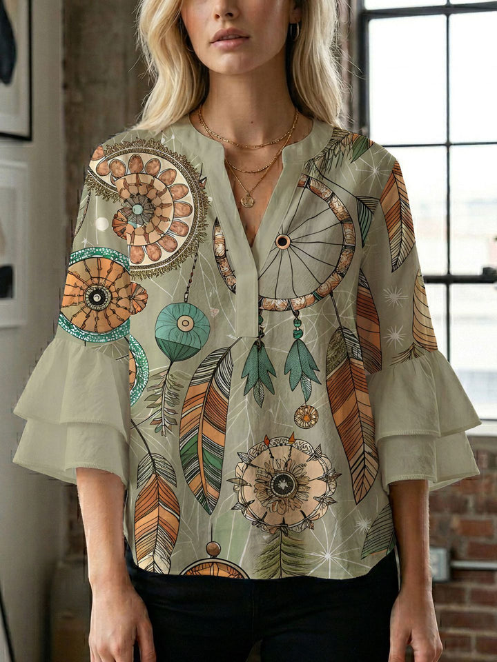 Dame bluse med voluminøse ærmer og kreativt trykdesign Skovae